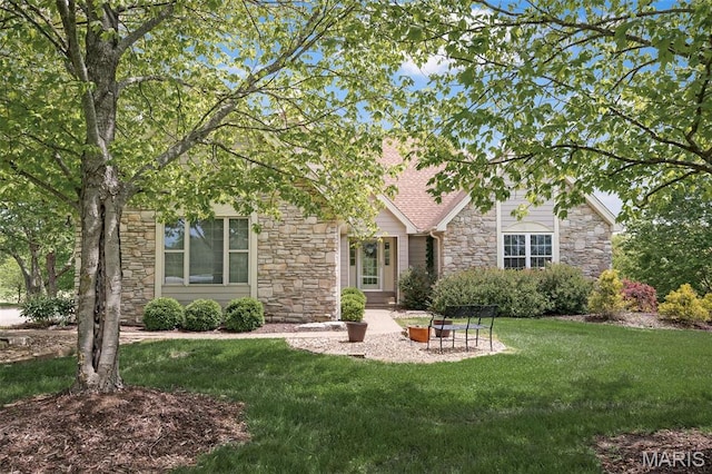 1189 Turnberry Dr, Innsbrook, MO 63390 - back of house with stone siding and a yard