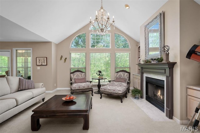1189 Turnberry Dr, Innsbrook, MO 63390 - living room with light colored carpet, a chandelier, a premium fireplace, high vaulted ceiling, and baseboards