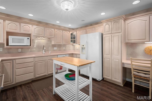1189 Turnberry Dr, Innsbrook, MO 63390 - kitchen with white appliances, a sink, dark wood-type flooring, light countertops, and recessed lighting