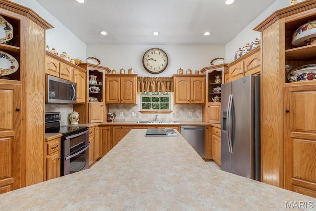 24473 Remington, Lebanon, MO 65536 - kitchen featuring open shelves, appliances with stainless steel finishes, a sink, light countertops, and tasteful backsplash