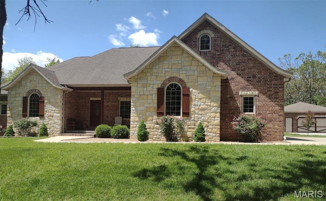 24473 Remington, Lebanon, MO 65536 - french country home with stone siding, a front yard, brick siding, and roof with shingles