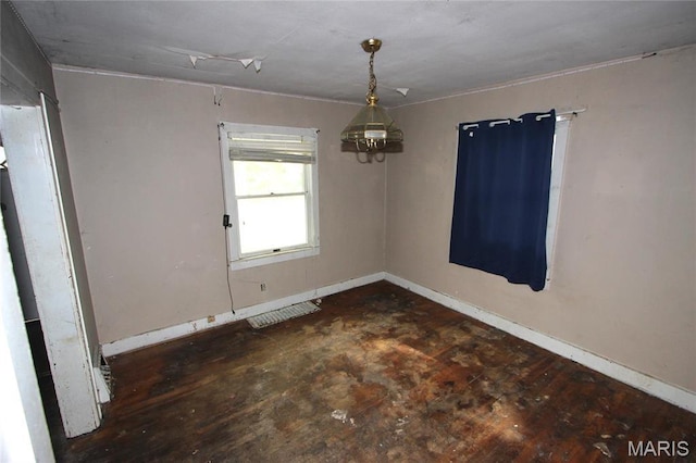 408 S A St, Farmington, MO 63640 - unfurnished room featuring baseboards and a chandelier