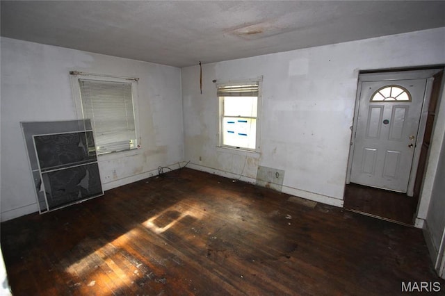 408 S A St, Farmington, MO 63640 - unfurnished living room featuring hardwood / wood-style floors and baseboards