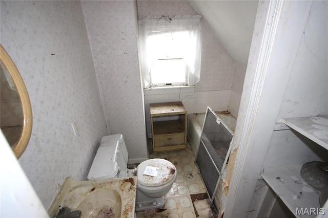 408 S A St, Farmington, MO 63640 - bathroom featuring vaulted ceiling, toilet, and tile patterned floors
