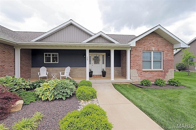 108 Buford Mountain Rd, Farmington, MO 63640 - view of front facade with a front lawn, board and batten siding, a porch, and brick siding