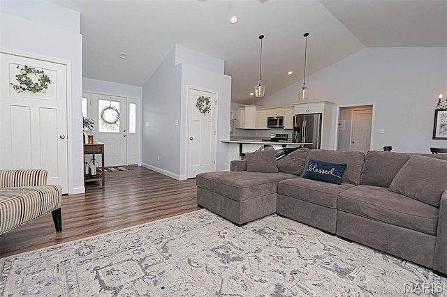 108 Buford Mountain Rd, Farmington, MO 63640 - living room with dark wood-type flooring, high vaulted ceiling, and baseboards