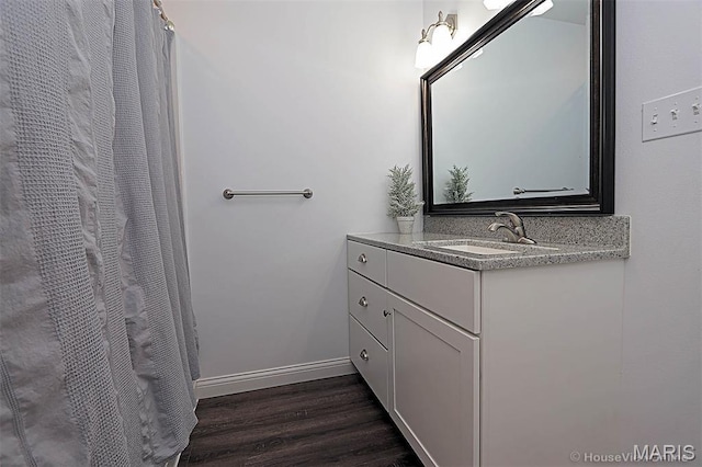 108 Buford Mountain Rd, Farmington, MO 63640 - full bathroom featuring wood finished floors, vanity, baseboards, and a shower with curtain