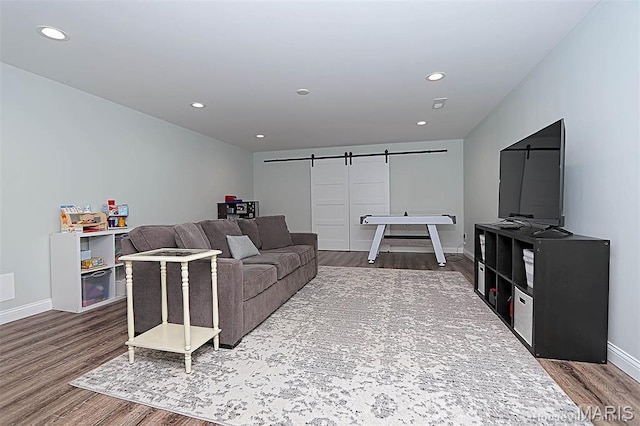 108 Buford Mountain Rd, Farmington, MO 63640 - living room featuring a barn door, wood finished floors, baseboards, and recessed lighting