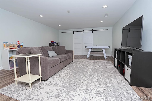 108 Buford Mountain Rd, Farmington, MO 63640 - living area with a barn door, wood finished floors, recessed lighting, and baseboards