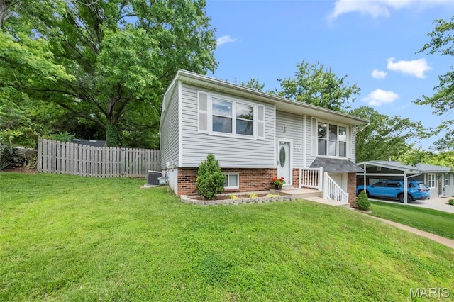 bi-level home with cooling unit and a carport