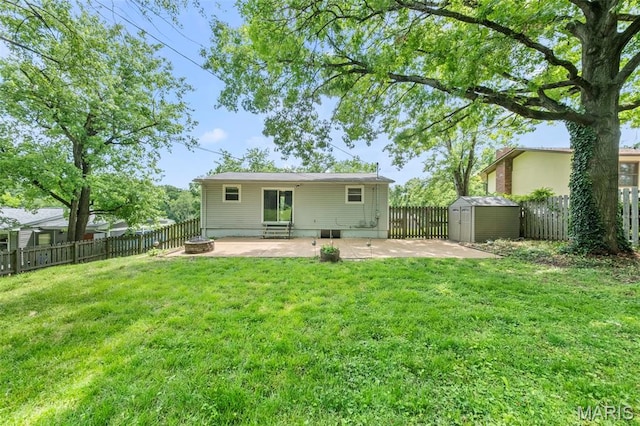back of property with a patio, a storage unit, and an outdoor structure