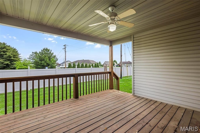 wooden terrace with a ceiling fan