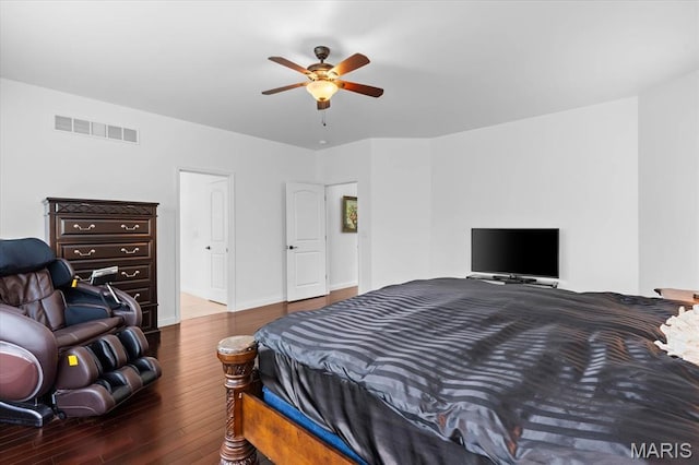 bedroom with wood finished floors, ceiling fan, and baseboards