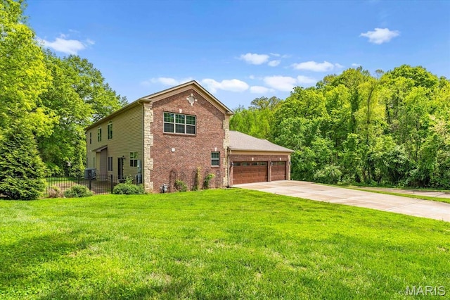 view of front of property with driveway, brick siding, and a garage