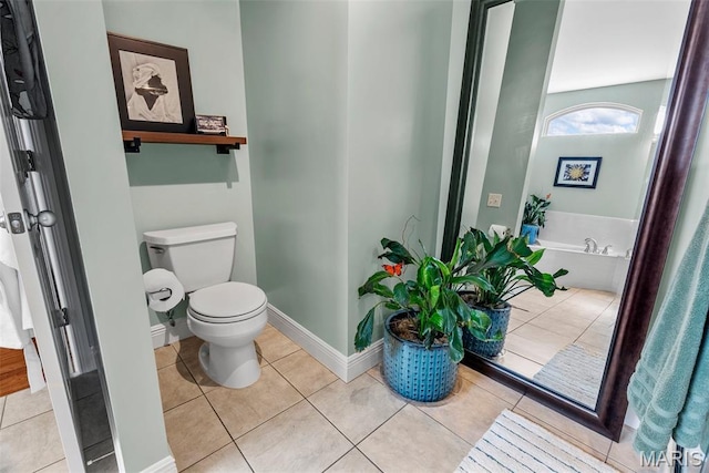 bathroom featuring toilet, a bath, and tile patterned flooring