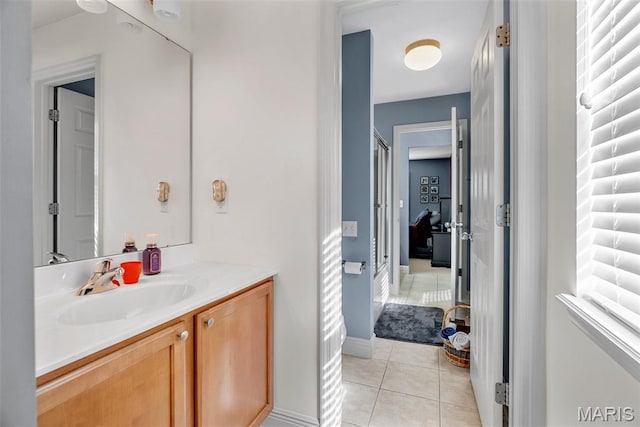 bathroom featuring tile patterned flooring and vanity