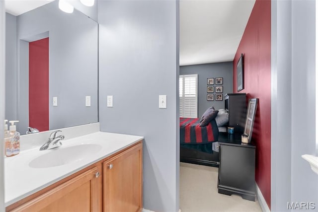 bathroom featuring vanity and baseboards