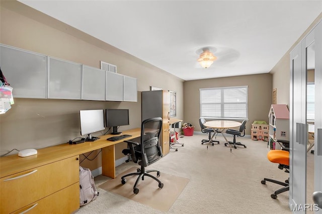 carpeted office with baseboards