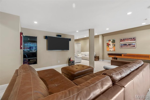 living room with baseboards and recessed lighting