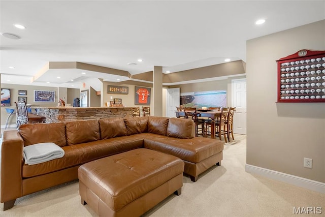 living area with light carpet, recessed lighting, and baseboards