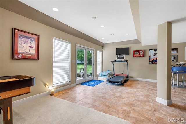 exercise area with baseboards, light tile patterned floors, and recessed lighting
