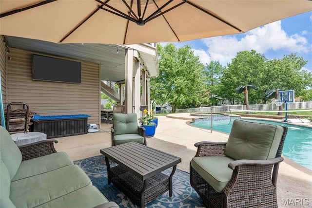 view of patio with an in-ground hot tub and an outdoor hangout area