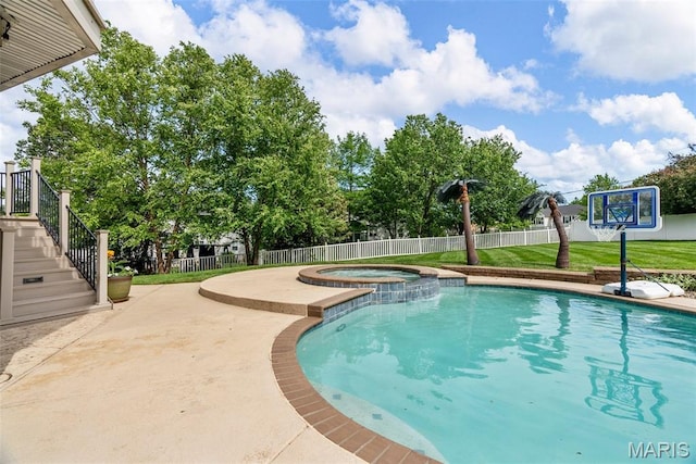 view of swimming pool with a patio area, stairway, and a pool with connected hot tub