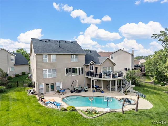 rear view of house with a deck, stairs, and a patio area