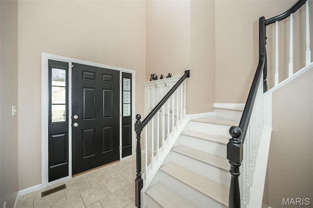 1119 Maywood Dr, Eureka, MO 63025 - entrance foyer featuring a towering ceiling, stairs, and light tile patterned floors
