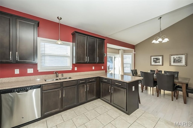 1119 Maywood Dr, Eureka, MO 63025 - kitchen with stainless steel dishwasher, light countertops, lofted ceiling, a chandelier, and hanging light fixtures