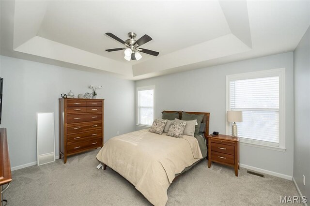 1119 Maywood Dr, Eureka, MO 63025 - bedroom with a raised ceiling, light colored carpet, and a ceiling fan