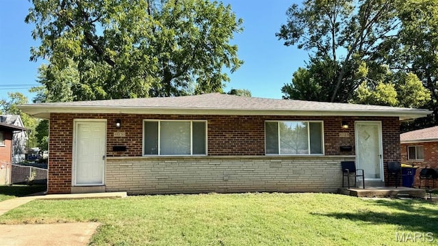 4028 Esseldale Dr, Saint Ann, MO 63074 - view of front of property with brick siding and a front yard