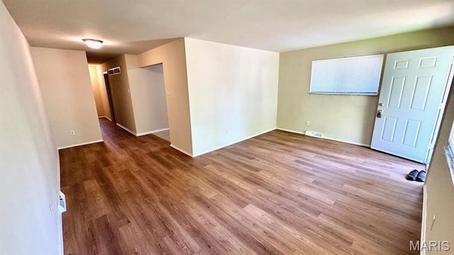4028 Esseldale Dr, Saint Ann, MO 63074 - spare room featuring wood finished floors and baseboards