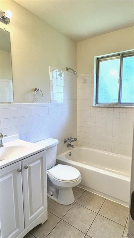 4028 Esseldale Dr, Saint Ann, MO 63074 - bathroom with tile walls, tile patterned floors, bathtub / shower combination, toilet, and vanity