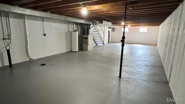 4028 Esseldale Dr, Saint Ann, MO 63074 - below grade area featuring gas water heater and stairway