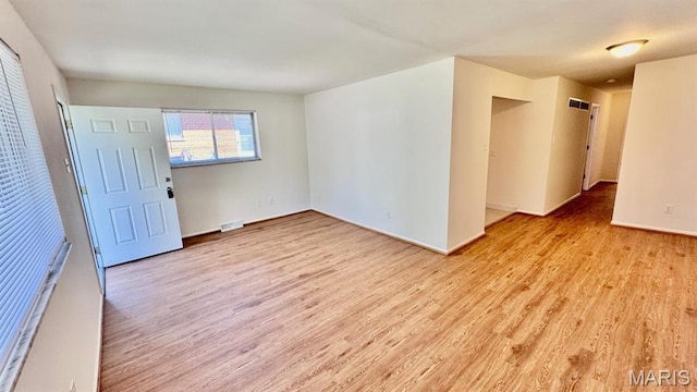 4028 Esseldale Dr, Saint Ann, MO 63074 - empty room featuring light wood-type flooring and baseboards
