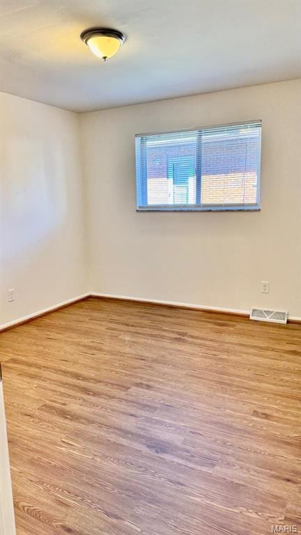 4028 Esseldale Dr, Saint Ann, MO 63074 - unfurnished room with wood finished floors and baseboards