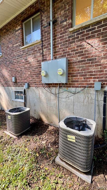 4028 Esseldale Dr, Saint Ann, MO 63074 - exterior view of central air condition unit and brick siding