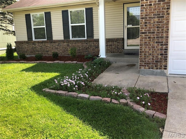 1215 Brookstone Ln, Lake St Louis, MO 63367 - entrance to property featuring brick siding, a yard, and covered porch