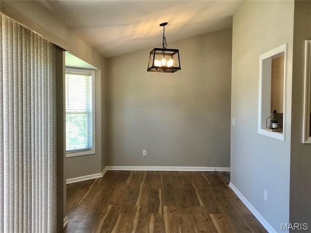 1215 Brookstone Ln, Lake St Louis, MO 63367 - unfurnished room featuring dark wood finished floors, a chandelier, vaulted ceiling, and baseboards