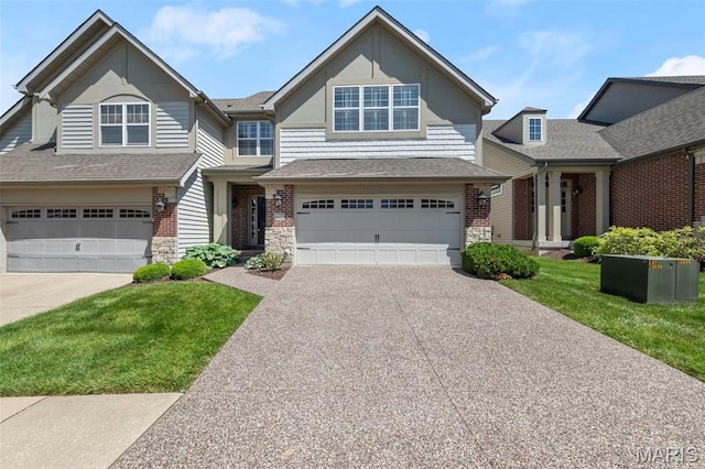 427 Newkirk Cir, Saint Charles, MO 63303 - view of front facade featuring concrete driveway, a garage, stone siding, and a front lawn