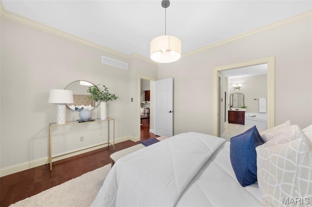 427 Newkirk Cir, Saint Charles, MO 63303 - bedroom with crown molding, wood finished floors, ensuite bath, and baseboards