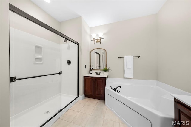 427 Newkirk Cir, Saint Charles, MO 63303 - full bath featuring vanity, a shower stall, a garden tub, and tile patterned floors