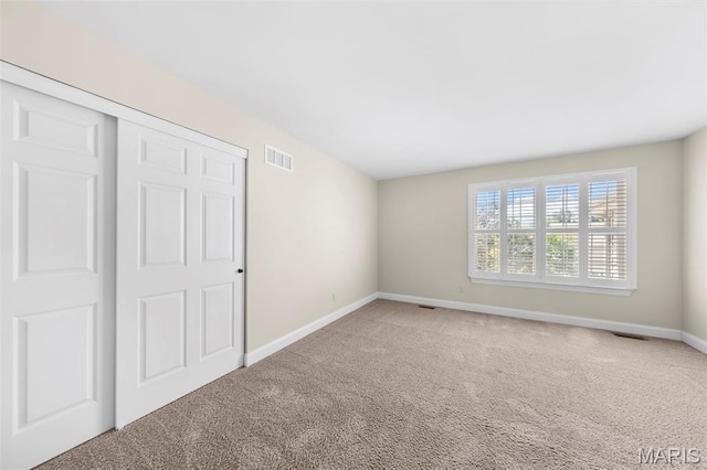 427 Newkirk Cir, Saint Charles, MO 63303 - unfurnished bedroom featuring carpet floors, baseboards, and a closet