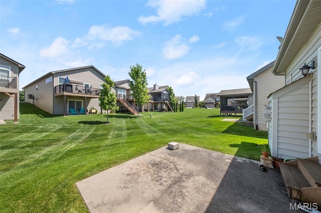 427 Newkirk Cir, Saint Charles, MO 63303 - view of grassy yard with a residential view, stairway, a patio area, and a wooden deck