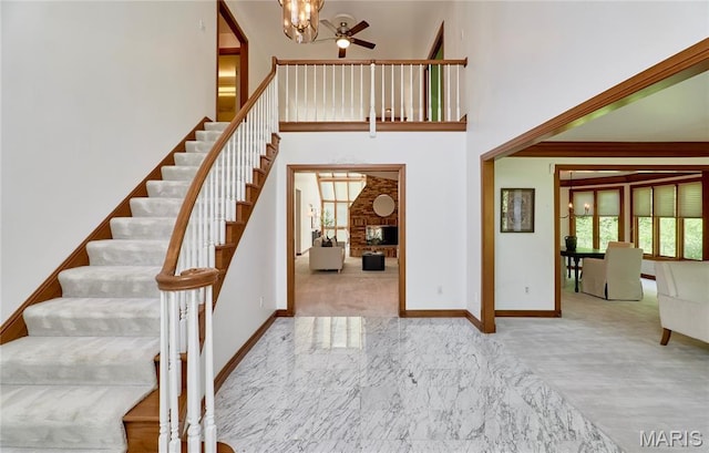 14424 Valley Meadow Ct W, Chesterfield, MO 63017 - stairs with plenty of natural light, ceiling fan, carpet floors, and a high ceiling