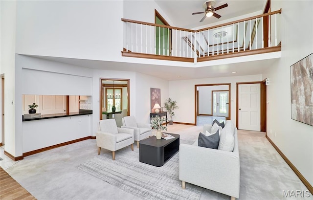 14424 Valley Meadow Ct W, Chesterfield, MO 63017 - carpeted living area with a towering ceiling and ceiling fan