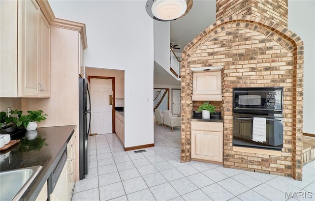14424 Valley Meadow Ct W, Chesterfield, MO 63017 - kitchen featuring black appliances, dark countertops, a ceiling fan, light tile patterned floors, and high vaulted ceiling