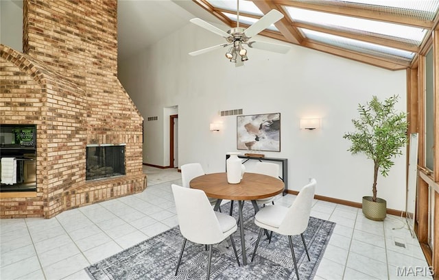 14424 Valley Meadow Ct W, Chesterfield, MO 63017 - dining room featuring light tile patterned floors, high vaulted ceiling, a brick fireplace, and ceiling fan