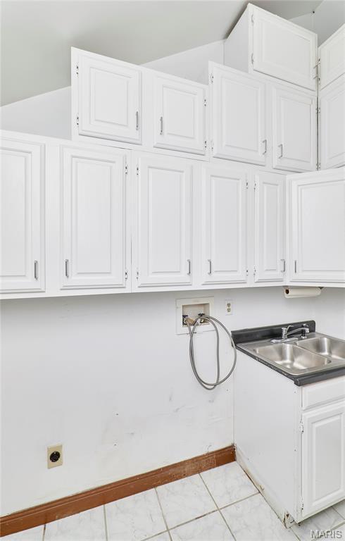 14424 Valley Meadow Ct W, Chesterfield, MO 63017 - washroom featuring washer hookup, hookup for an electric dryer, and cabinet space
